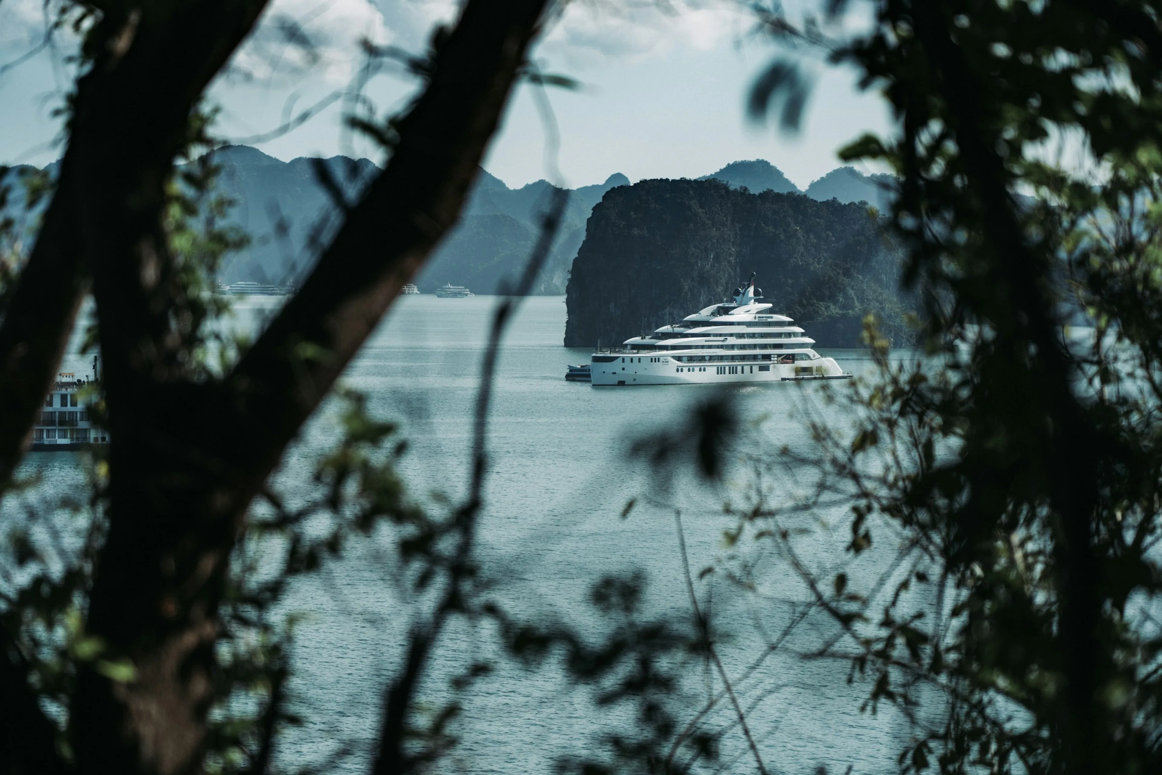 Small yacht on calm tropical water
