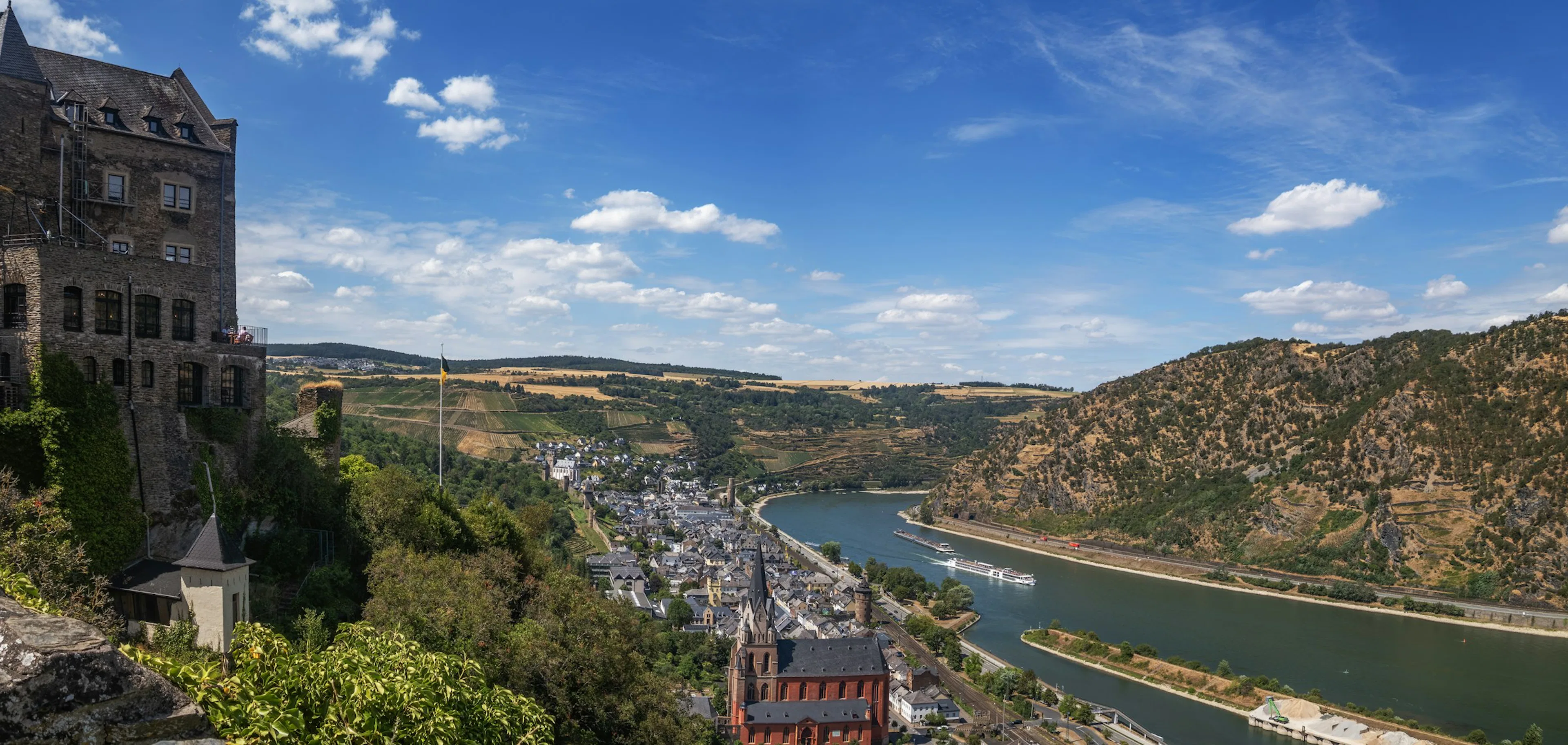 River cruise vessel passing a German castle