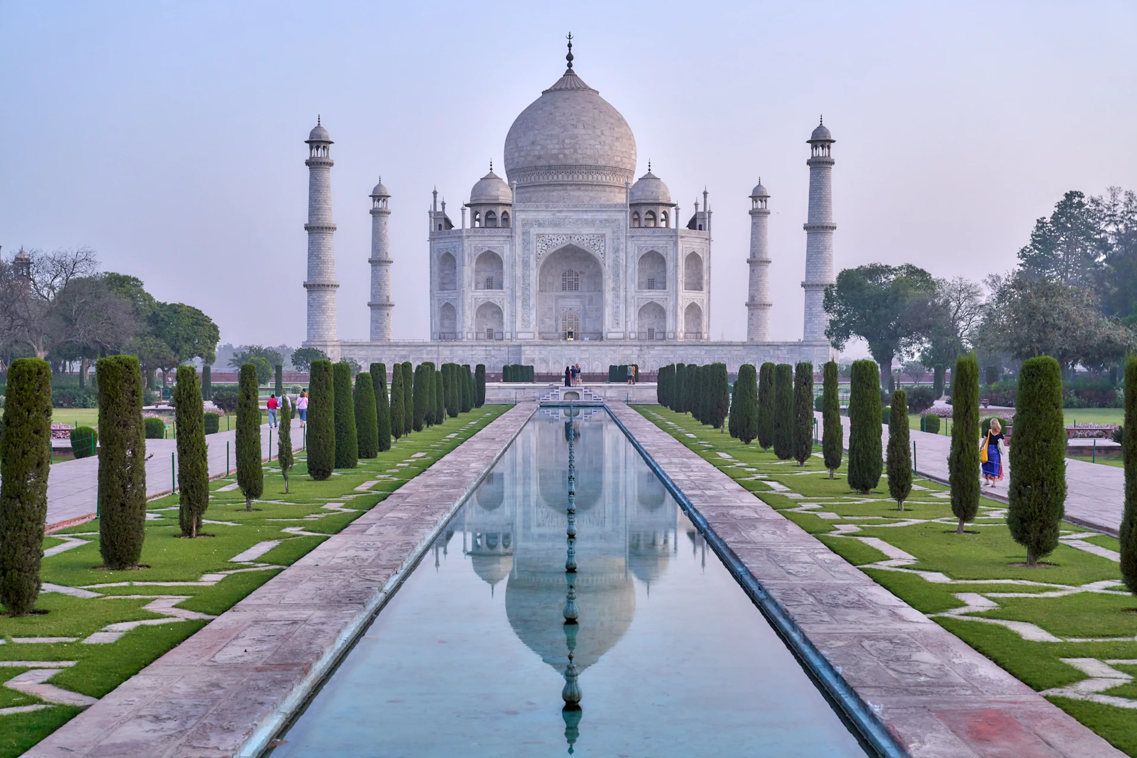 Taj Mahal at sunrise with reflecting pool