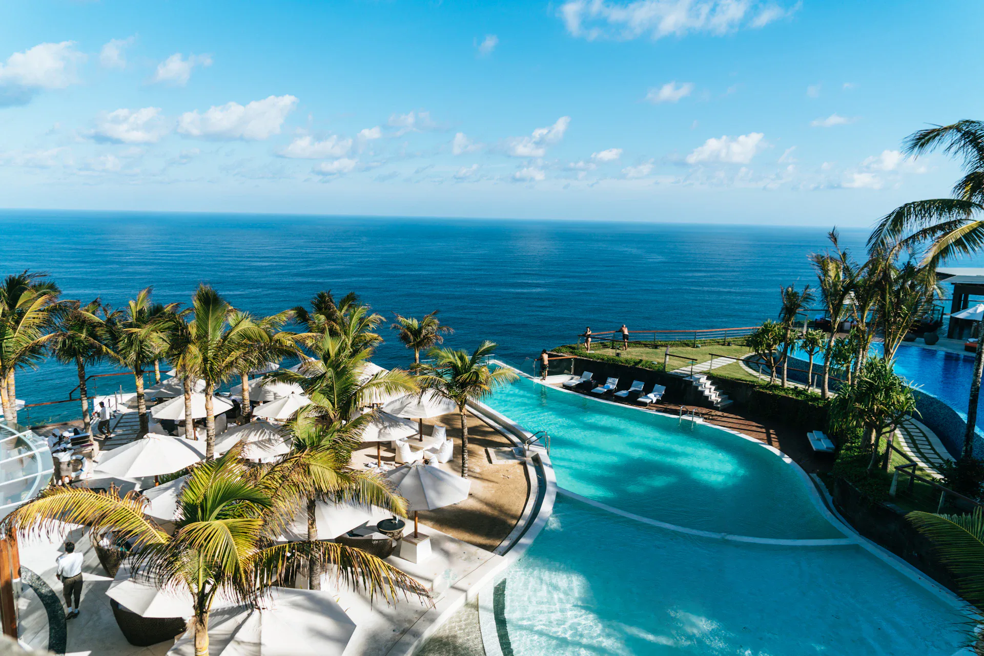 Luxury infinity pool overlooking the ocean at sunset